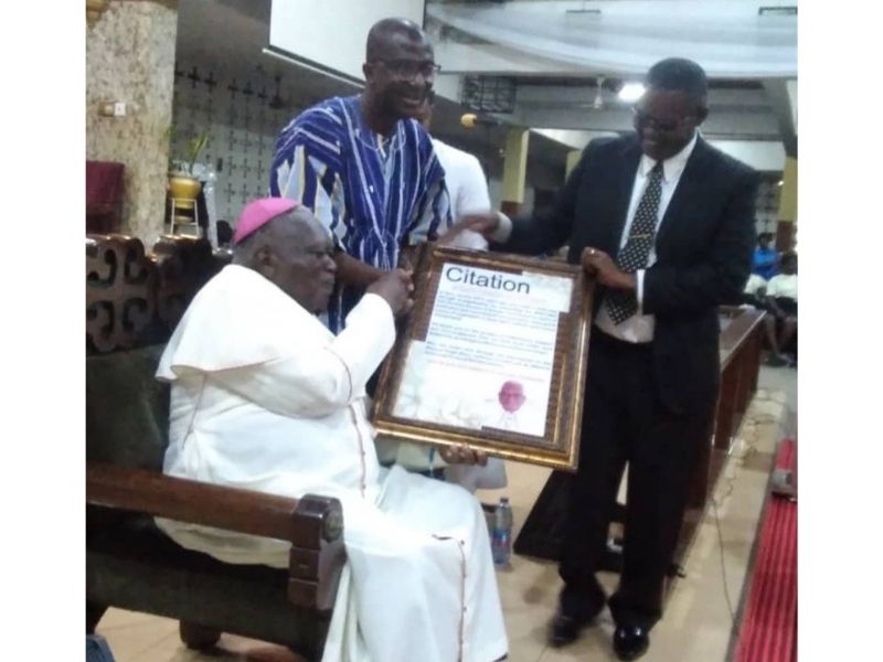 Second Deputy Speaker of Parliament,Andrews Asiamah presenting the Citation o the Archbishop Emeritus Sarpong