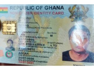 Chinese  Illegal  Immigrants  Holding  Ghana cards