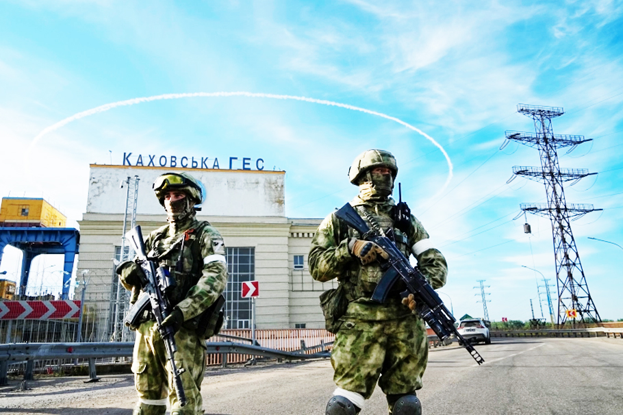 Russian troops guard an entrance to the Kakhovka Hydroelectric Station, a power plant on the Dnieper river in Kherson region, southern Ukraine
