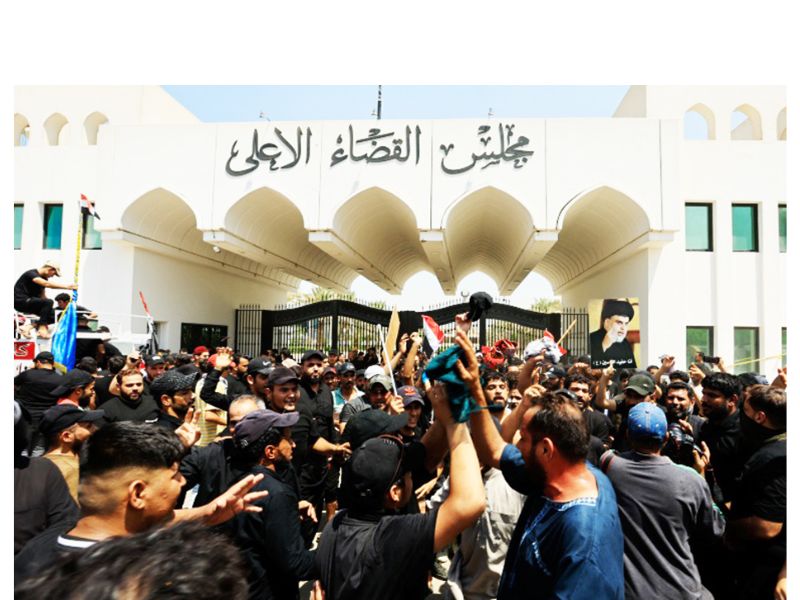 Supporters of Iraqi populist leader Muqtada al-Sadr gather for a sit-in in front of the Supreme Judicial Council,