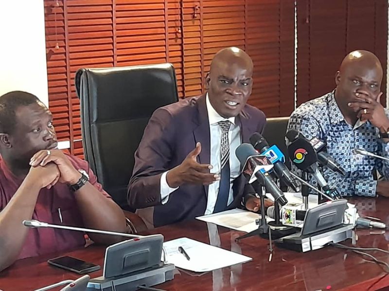 Minority Leader, Mr Haruna Iddrisu, flanked by First Deputy Minority Whip, Ahmed Ibrahim(right) and Member of Communication Committee, Mr Sam George ( left).
