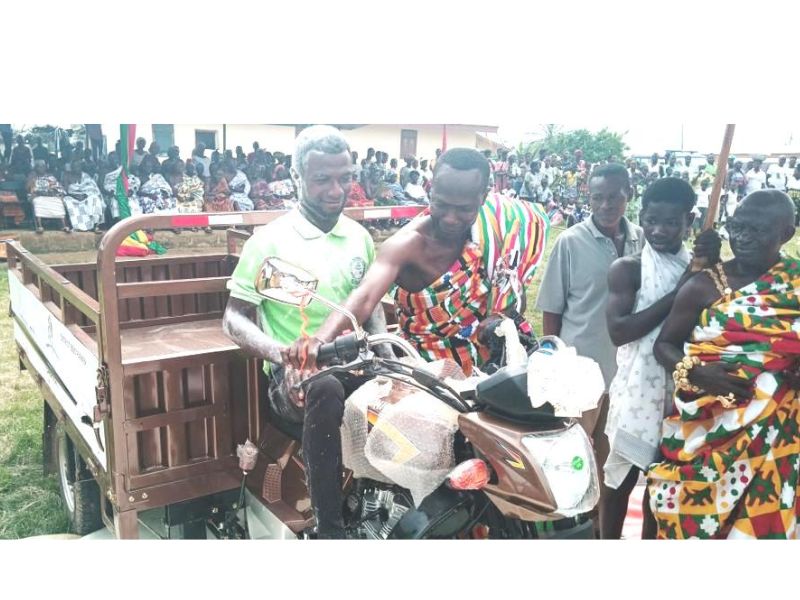 DCE Jonas Woode (in kente) handing over the motorking (Aboboyaa) to the best farmer Mr. Joseph Ayaaba