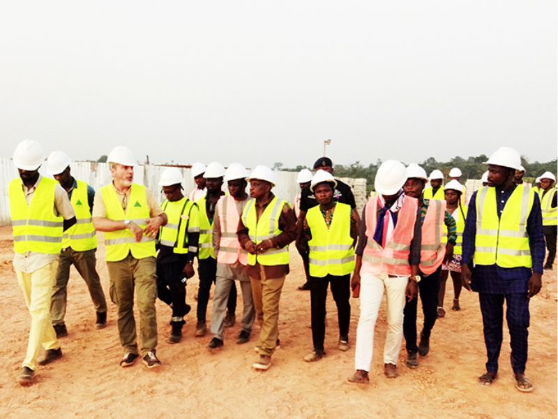 Ashanti regional minister, Mr Simon Osei-Mensah in conferring with a contractor during the inspection of agenda 111 project at Ahafo-Ano South West district of the Ashanti region
