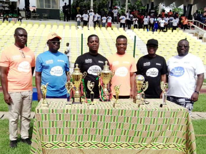 The Municipal Chief Executives (MCEs) and Ing. George Asiedu pose for a photograph with trophies of the games