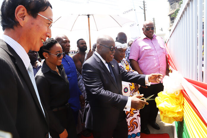 President Akufo-Addo, (middle), being assisted by, Mochizuki Hisanobu (first from left), Japanese Ambassador to Ghana, Zinator Rawlings (2nd from left), MP For Korley Klottey, Henry Quartey (first from right), Greater Accra Regional Minister Nii Ayi Bonte, Gbese Mantse (2nd from right) to cut a ribbon to inaugurate the Bulk Supply Point (BSP) in Accra.