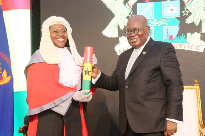 President Akufo-Addo, presenting an instrument of appointment to Chief Justice Gertrude Araba Esaaba Sackey Torkornoo at the Jubilee House