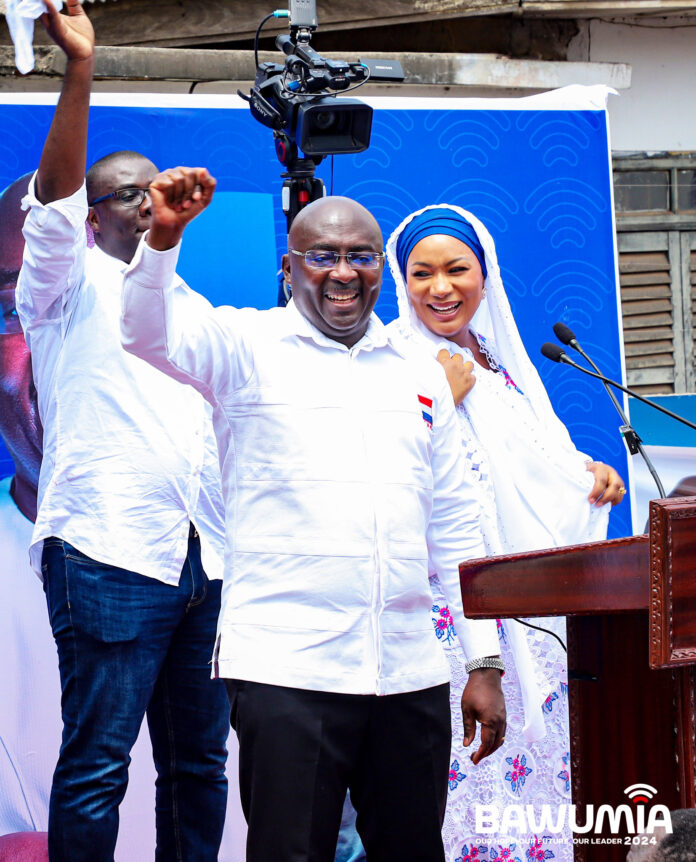 Vice President Bawumia resonding to cheers from the teeming supporters. With him are his wife and NLA boss, Sammy Awuku