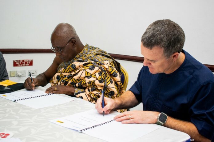 David Thornton, Regional Senior Vice President for Newmont Africa, and Nana Prof. Oheneba Boachie-Adjei Woahene II, the chairman of the Otumfuo Foundation, signing the MoU