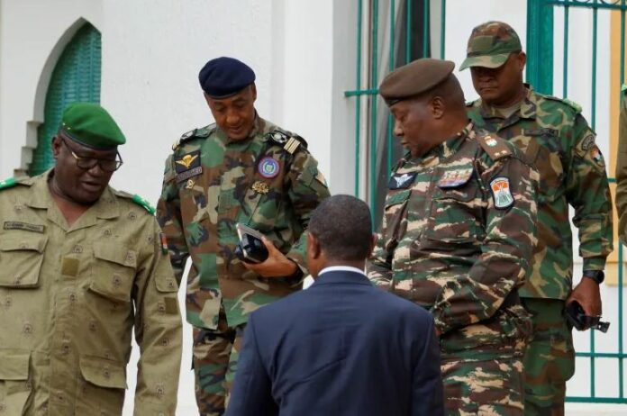 General Abdourahmane Tiani, who was declared as the new head of state of Niger by leaders of a coup, arrives to meet with ministers in Niamey, Niger