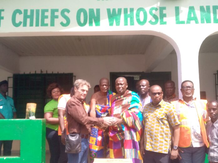 Marc Genot handing over the relief items to Nana Kwesi Agyemang for onward distribution to the Assemblies