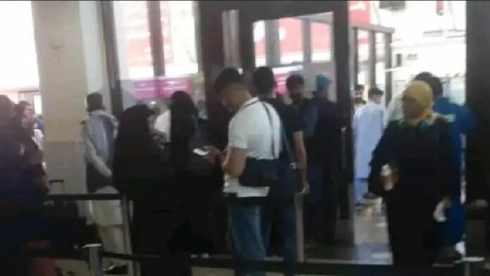 A grainy image from Kabul airport as the female students setting off for Dubai queued to go through security