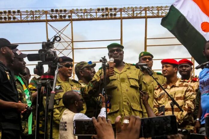 Members of a military council that staged a coup in Niger attend a rally at a stadium in Niamey, Niger, August 6, 2023