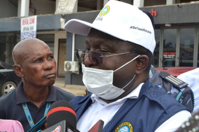 Mr. Joseph Annan, Head of Accra Central Enforcement Unit of GRA, briefing the press. Pix by Eric Owiredu