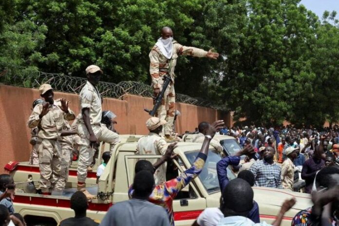 Nigerien security forces prepare to disperse pro-coup demonstrators gathered outside the French embassy, in Niamey, the capital city of Niger July 30, 2023