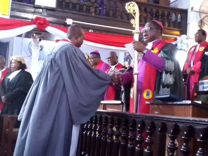 Bishop Paul Kwabena Boafo congratulating Brother Kwasi Attah-Antwi on his new position as Lay President of Conference