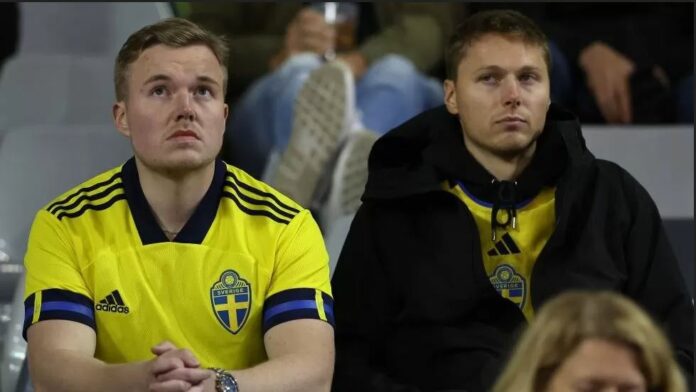 Fans were held in a Brussels stadium as a match was suspended after the shooting of Swedish nationals