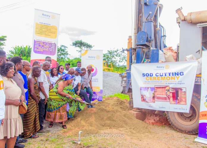 Nana Amponsah Agyeman III, Queen Mother of Kona being assisted by Rotary Club Executives to break the grounds for the projects