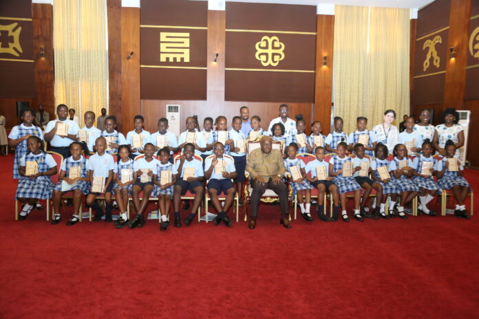 President Akufo-Addo (middle), in a photograph with pupils from Association International School after a meeting at Jubilee House.