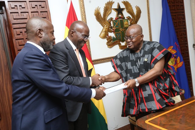 President Akufo-Addo (in smock), receiving a copy of the GIADEC Report from Michael Ansah (2nd from left), Chief Executive Officer, GIADEC and Kwesi Osei Ofori (left), Chief Executive Officer Rocksure Internationa