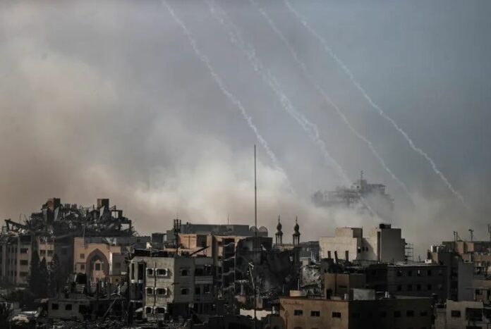 Smoke rises following an Israeli airstrike in Tel al-Hawa neighbourhood, where buildings are heavily damaged or collapsed in the southern part of Gaz