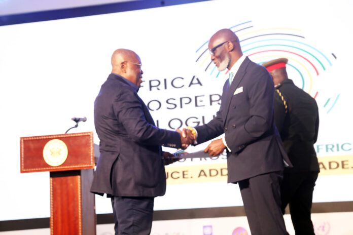 President Akufo-Addo receiving the poicy document from Gabby Okyere-Darko, founder of the APN at the closing ceremony of the APD at Peduase