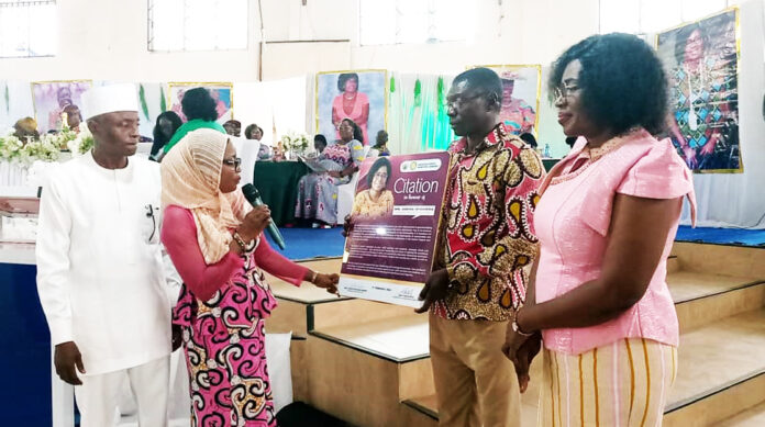Ms. Abena Gyamera, the Municipal Director of Education for Abuakwa North (standing at right far end)