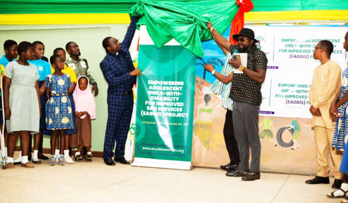 Dr. Francis Aboagye Kwarteng (in hat), being assisted by Rev. Osei Agyemang of the Konongo Bethel Presbytery to launch the EAGDIS project