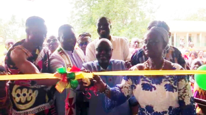 Dr. Antwi Mensah (middle) commissioning the facility with support of his wife, clergy and opinion leaders