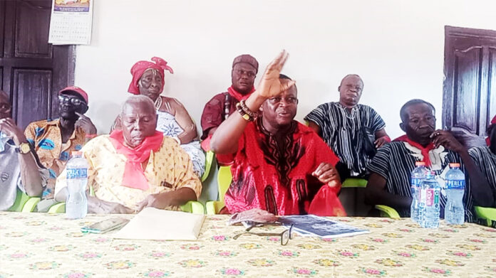 Nomo Isaac Sappor addressing the media. With him are some members from nine of the twelve Ada-Foah Gates