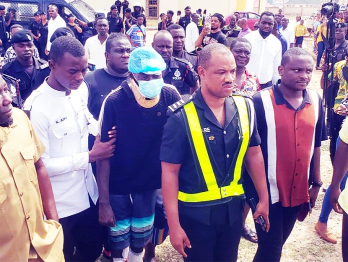 Movie Star and commedian being taken away by the police ,after the court proceedings at the Asokore Mampong District Court.