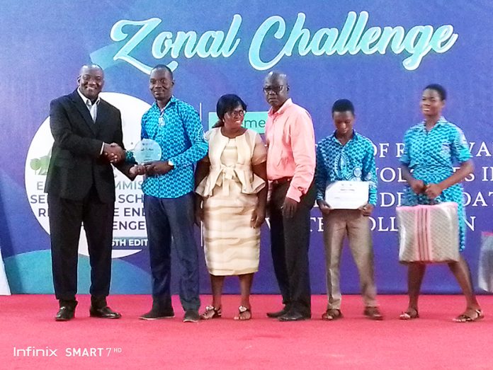 Kpando Senior High School receiving a Citation from Energy Commission Executive Secretary as the Southern Zone Champions