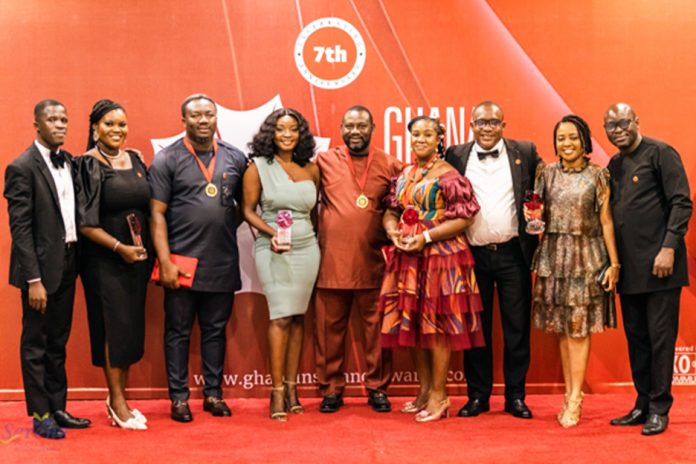 Staff of Serene Insurance in a group photograph pose with the awards won at the 7th Ghana Insurance Awards at the Labadi Beach Hotel in Accra