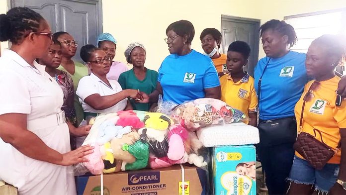 The patron of SEMS Family Touch Foundation, Madam Susie Akpene Dziekpor donating the items to management of the hospital