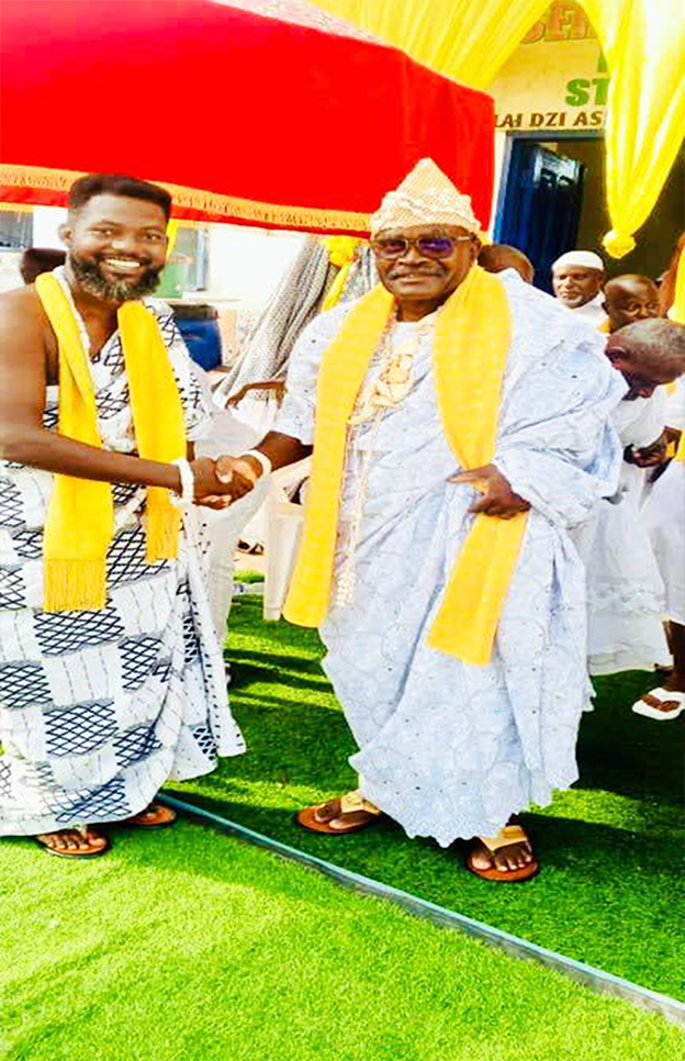 Sparqlyn in a handshake with Paramount Chief of the Asere Traditional Area, HRM Nii Nikoi Olai Amashie III
