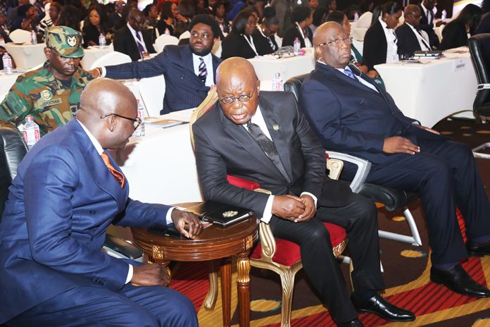 President Akufo-Addo (2nd from right), interacting with Godfred Dame (left), Minister of Justice and Attorney General