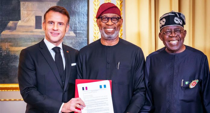 French President, Emmanuel Macron, in a photograph with his Nigerian counterpart, Bola Tinubu and the Minister of Solid Minerals Development,