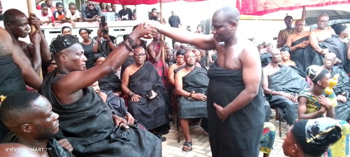 Nana Otiawere Frimpong exchanging pleasantries with Nana Osako Adu Panin after swearing the Oath of allegiance