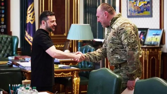 Ukrainian President Volodymyr Zelensky shakes hands with the Head of the Security Service Vasyl Malyuk