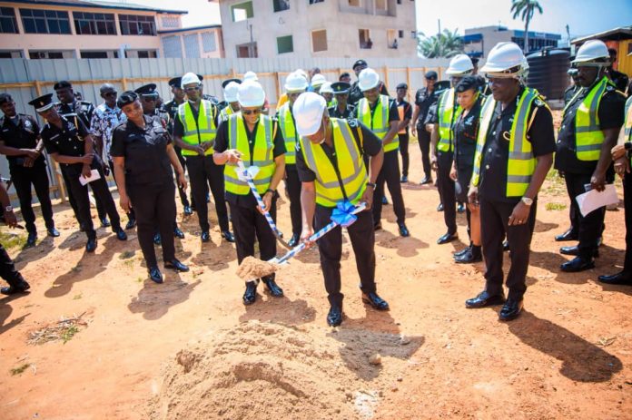 IGP, Christian Tetteh Yohuno, (with shovel in hand) performing the ground breaking as the Director General of Police Welfare, COP, Mr Iddi Lansah demonstrates his skills on another tool.