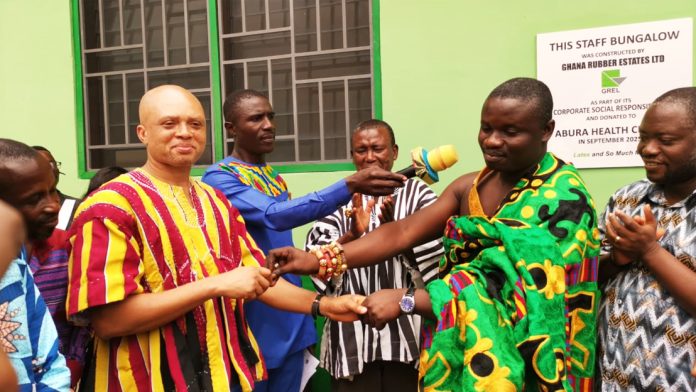 Nana Kweku Mensah IV, Abura chief handing over the keys of the bungalow to the Municipal Health Director