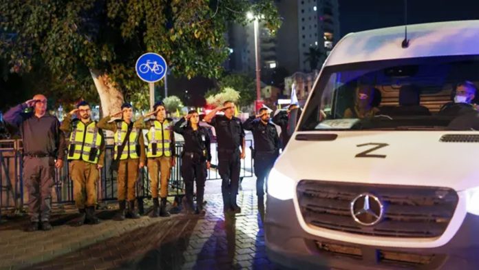 Israeli security forces saluted as the coffin arrive