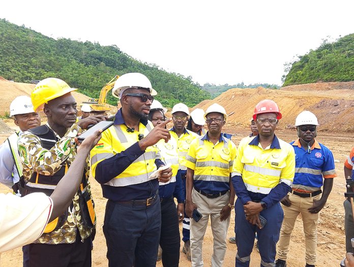 Sankofa Mines MD Ishaq Dauda (2nd left) addressing journalist at the mines tailim dam construction