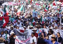 Thousands protest against government in Mexico as clashes leave 120 injured