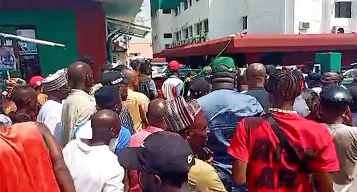 Supporters accompany Abdrahman Mohammed as he makes his way into the PDP secretariat