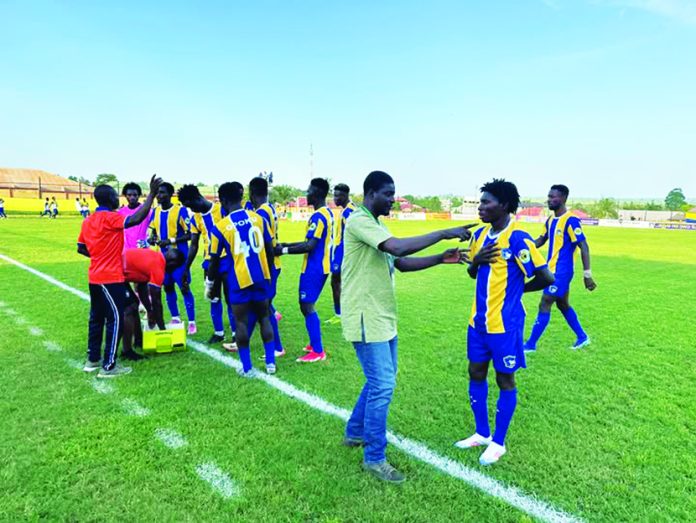 Young Apostles players having a water break