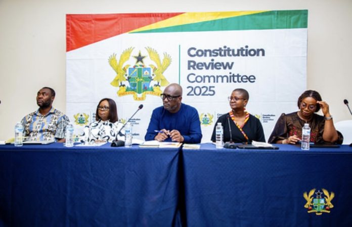 Members of the Constitutional Review Committee seated at an official engagement.