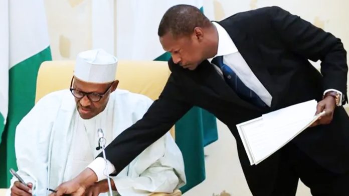 Ex-Justice minister Abubakar Malami (right)