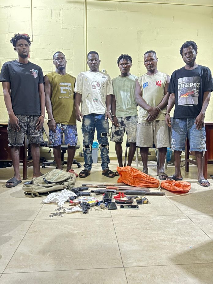 The arrested suspects and exhibits retrieved by the police.