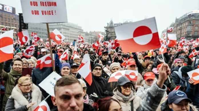 Protesters in Copenhagen waved Greenland's white and red flag in support of self-determination