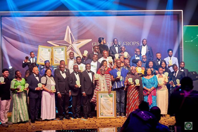 Dr. Andy Osei Okrah, CEO of the Tree Crop Development Authority (TCDA), poses with the 2026 Tree Crop Excellence Award winners following the awards ceremony